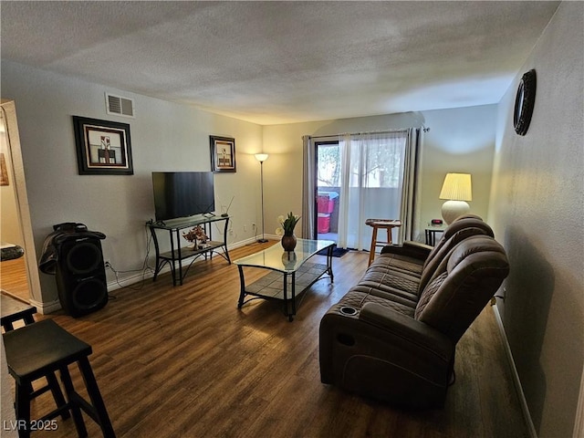 2451 N Rainbow Blvd Unit 1123, Las Vegas, NV 89108 - living room featuring dark wood finished floors and a textured ceiling