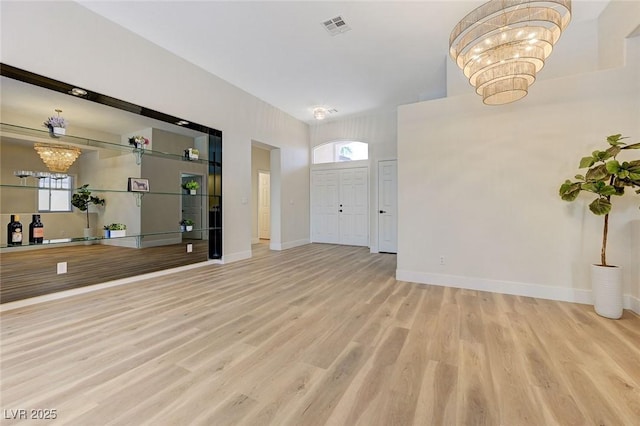 9632 Cherry Canyon Ave, Las Vegas, NV 89129 - entrance foyer featuring a chandelier and wood finished floors