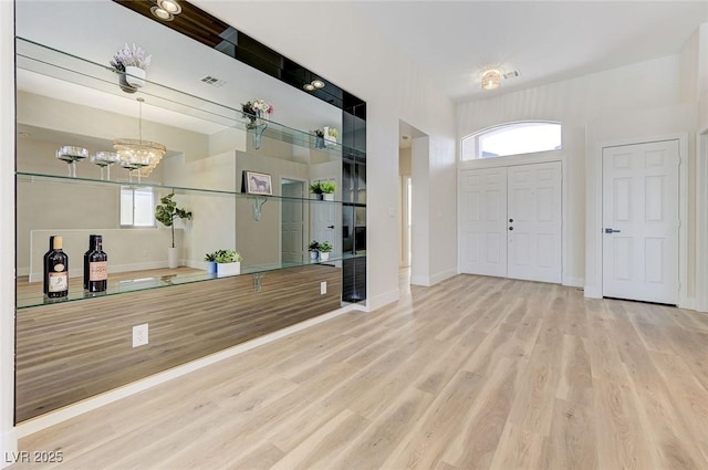 9632 Cherry Canyon Ave, Las Vegas, NV 89129 - entrance foyer featuring wood finished floors, plenty of natural light, and a chandelier