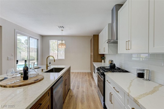 9632 Cherry Canyon Ave, Las Vegas, NV 89129 - kitchen with appliances with stainless steel finishes, light wood-style flooring, backsplash, and white cabinets
