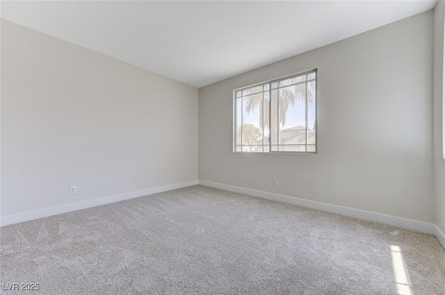 9632 Cherry Canyon Ave, Las Vegas, NV 89129 - unfurnished room with baseboards and light carpet