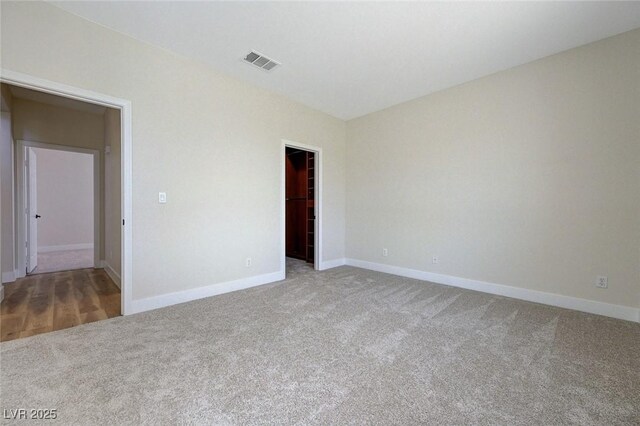 9632 Cherry Canyon Ave, Las Vegas, NV 89129 - unfurnished bedroom with carpet flooring, a walk in closet, and a closet