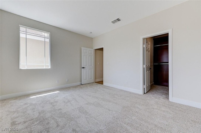 9632 Cherry Canyon Ave, Las Vegas, NV 89129 - unfurnished bedroom with light colored carpet and a walk in closet