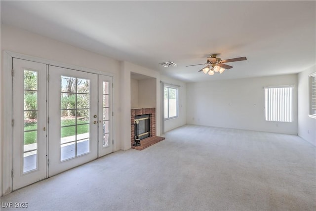 2728 Aspen Wood Ave, Henderson, NV 89074 - unfurnished living room with carpet floors, a brick fireplace, and ceiling fan