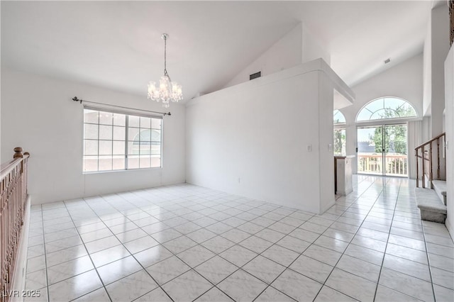 2728 Aspen Wood Ave, Henderson, NV 89074 - unfurnished room with a chandelier, light tile patterned flooring, healthy amount of natural light, stairway, and high vaulted ceiling