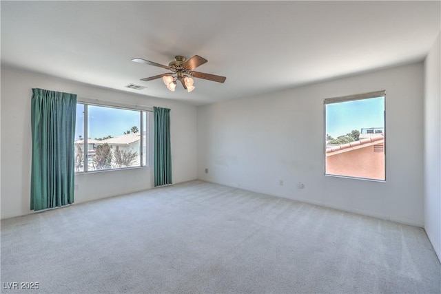 2728 Aspen Wood Ave, Henderson, NV 89074 - carpeted empty room featuring healthy amount of natural light and a ceiling fan