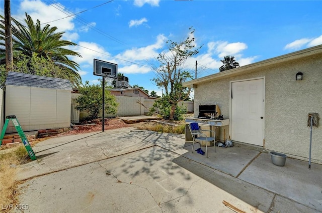 1804 David Ave, Las Vegas, NV 89101 - fenced backyard featuring a storage unit and a patio area