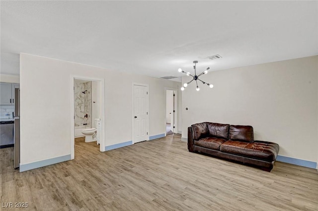 1804 David Ave, Las Vegas, NV 89101 - living room with a chandelier and light wood finished floors
