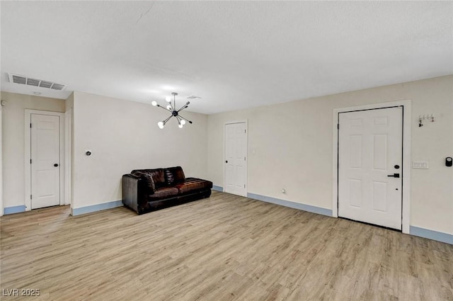 1804 David Ave, Las Vegas, NV 89101 - unfurnished room featuring light wood-style flooring and a chandelier