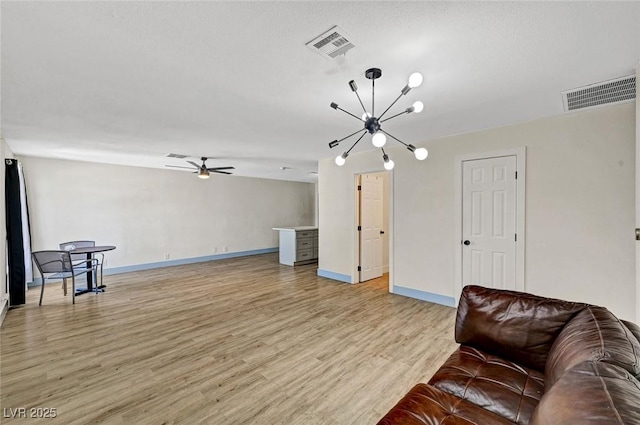 1804 David Ave, Las Vegas, NV 89101 - living room with a chandelier, light wood-type flooring, and a ceiling fan