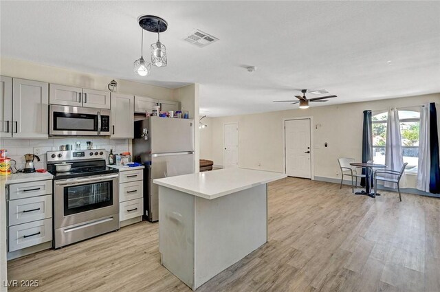 1804 David Ave, Las Vegas, NV 89101 - kitchen featuring stainless steel appliances, light countertops, ceiling fan, and light wood finished floors