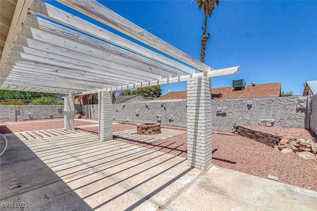 6808 Waterhen Cir, Las Vegas, NV 89108 - fenced backyard with a pergola, a fire pit, and a patio
