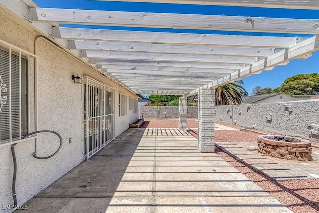 6808 Waterhen Cir, Las Vegas, NV 89108 - fenced backyard with an outdoor fire pit, a patio, and a pergola