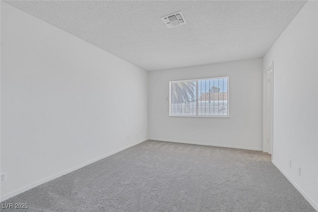 6808 Waterhen Cir, Las Vegas, NV 89108 - carpeted spare room with a textured ceiling and baseboards