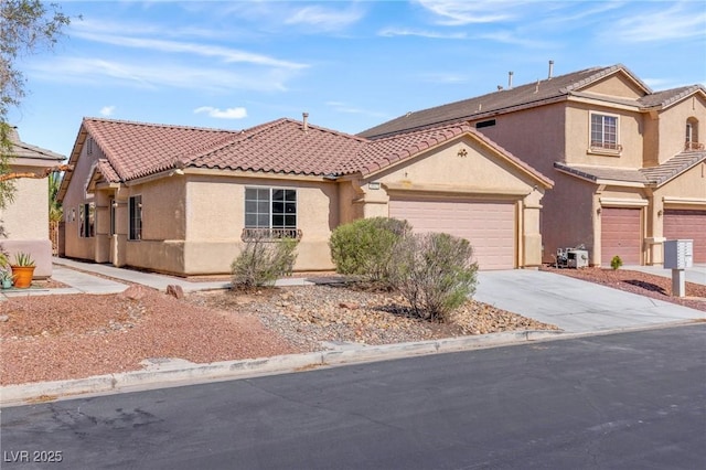 4043 Lilac Creek Ct, Las Vegas, NV 89122 - mediterranean / spanish-style home featuring a tile roof, stucco siding, driveway, and a garage