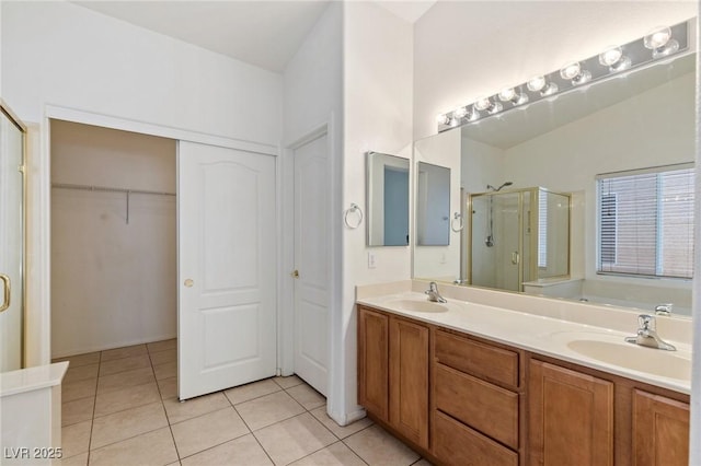 4043 Lilac Creek Ct, Las Vegas, NV 89122 - full bath with a shower stall, tile patterned flooring, double vanity, and a spacious closet