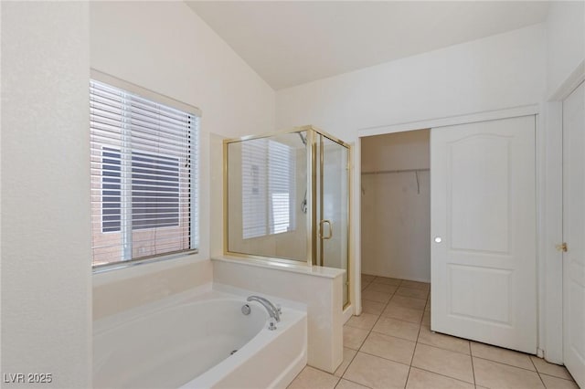 4043 Lilac Creek Ct, Las Vegas, NV 89122 - bathroom featuring a shower stall, tile patterned floors, a bath, and a walk in closet
