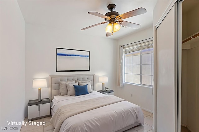 4043 Lilac Creek Ct, Las Vegas, NV 89122 - bedroom featuring light tile patterned flooring and a ceiling fan