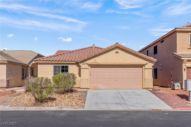 4043 Lilac Creek Ct, Las Vegas, NV 89122 - mediterranean / spanish-style house with a tiled roof, stucco siding, a garage, and concrete driveway
