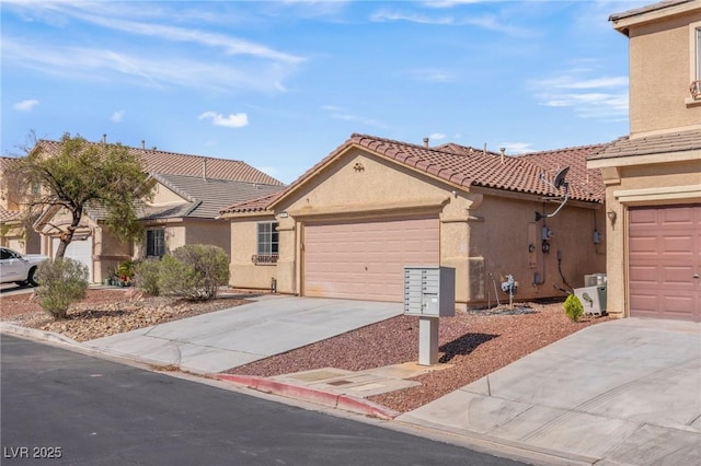 4043 Lilac Creek Ct, Las Vegas, NV 89122 - view of front of house with driveway, stucco siding, a garage, and a tile roof