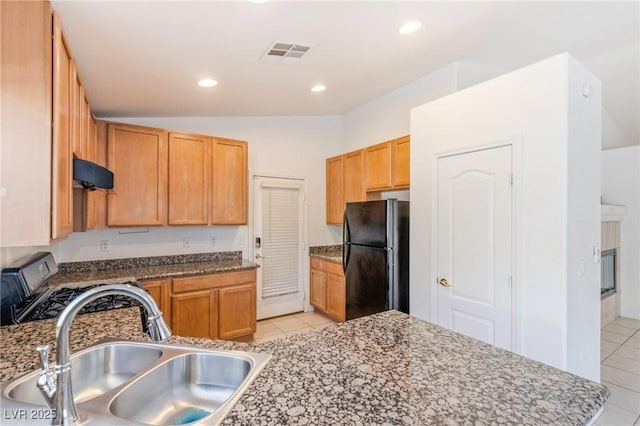 4043 Lilac Creek Ct, Las Vegas, NV 89122 - kitchen featuring freestanding refrigerator, light tile patterned flooring, gas stove, lofted ceiling, and recessed lighting