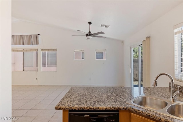 4043 Lilac Creek Ct, Las Vegas, NV 89122 - kitchen featuring lofted ceiling, stainless steel dishwasher, light tile patterned floors, ceiling fan, and stone countertops