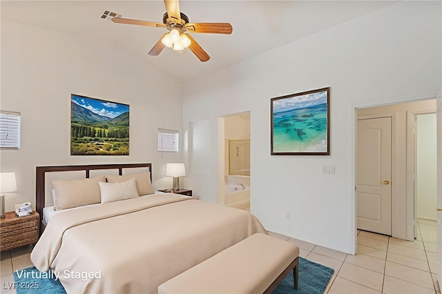 4043 Lilac Creek Ct, Las Vegas, NV 89122 - bedroom featuring light tile patterned floors, vaulted ceiling, connected bathroom, and ceiling fan
