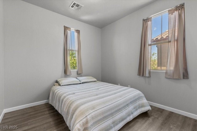 7818 Brodie Castle Ct, Las Vegas, NV 89166 - bedroom with multiple windows and wood finished floors