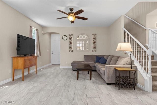 7818 Brodie Castle Ct, Las Vegas, NV 89166 - living room with ceiling fan, arched walkways, and stairs