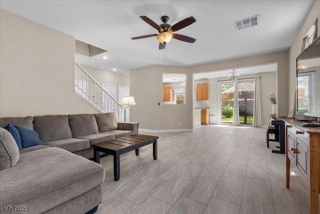 7818 Brodie Castle Ct, Las Vegas, NV 89166 - living room with stairs, a ceiling fan, a chandelier, and recessed lighting