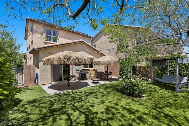 7818 Brodie Castle Ct, Las Vegas, NV 89166 - rear view of house with a tiled roof, a patio area, and stucco siding