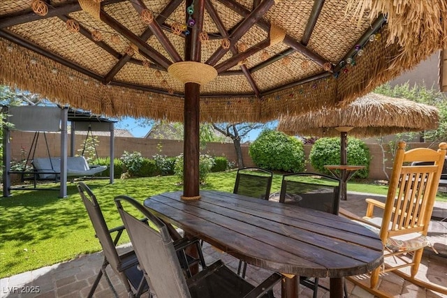7818 Brodie Castle Ct, Las Vegas, NV 89166 - fenced backyard featuring a gazebo, outdoor dining area, and a patio area