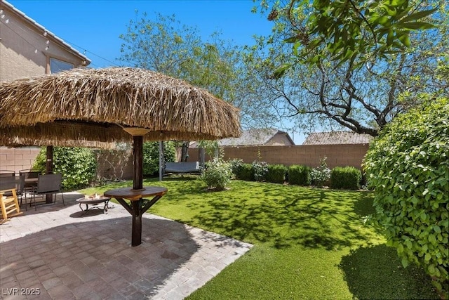 7818 Brodie Castle Ct, Las Vegas, NV 89166 - fenced backyard with a patio and an outdoor fire pit