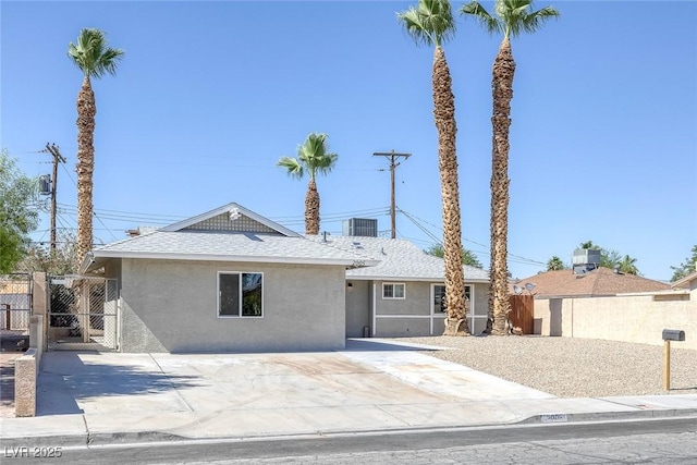 2005 Jansen Ave, Las Vegas, NV 89101 - single story home with stucco siding, a shingled roof, and a gate