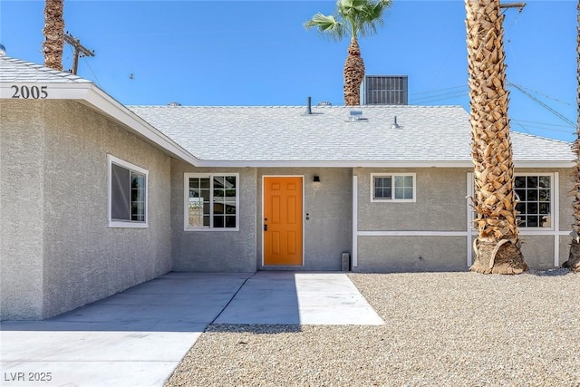 2005 Jansen Ave, Las Vegas, NV 89101 - view of exterior entry featuring stucco siding and roof with shingles