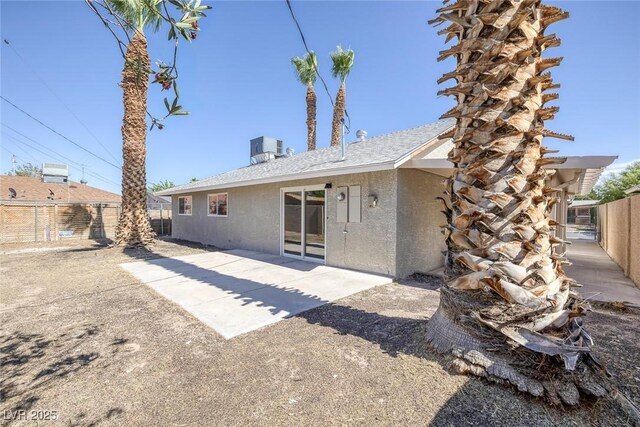 2005 Jansen Ave, Las Vegas, NV 89101 - back of property with stucco siding, a fenced backyard, and a patio