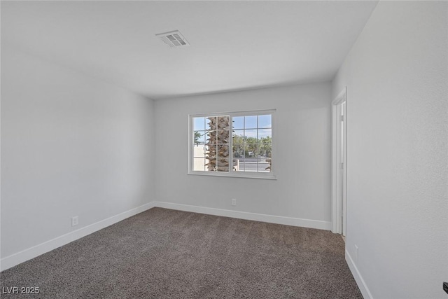 2005 Jansen Ave, Las Vegas, NV 89101 - spare room with dark colored carpet and baseboards