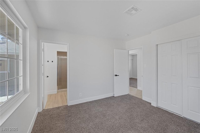 2005 Jansen Ave, Las Vegas, NV 89101 - unfurnished bedroom featuring carpet floors, multiple windows, a closet, and ensuite bathroom