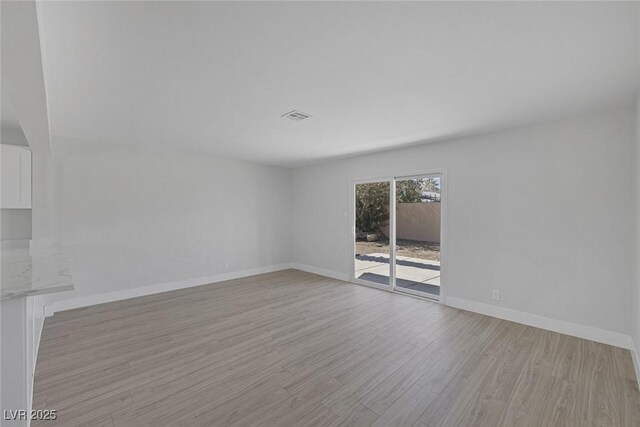 2005 Jansen Ave, Las Vegas, NV 89101 - unfurnished room featuring light wood-style flooring and baseboards