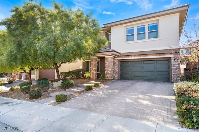 5735 Oak Bend Dr, Las Vegas, NV 89135 - view of front facade with stone siding, stucco siding, a garage, and driveway