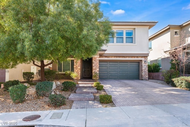 5735 Oak Bend Dr, Las Vegas, NV 89135 - view of front of home with stone siding, stucco siding, a garage, and driveway