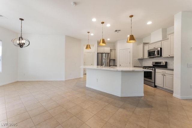 5735 Oak Bend Dr, Las Vegas, NV 89135 - kitchen with appliances with stainless steel finishes, backsplash, recessed lighting, pendant lighting, and a chandelier