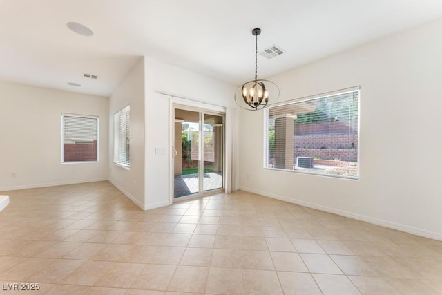 5735 Oak Bend Dr, Las Vegas, NV 89135 - empty room featuring a chandelier and light tile patterned floors