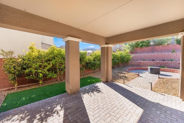 5735 Oak Bend Dr, Las Vegas, NV 89135 - fenced backyard featuring a patio area