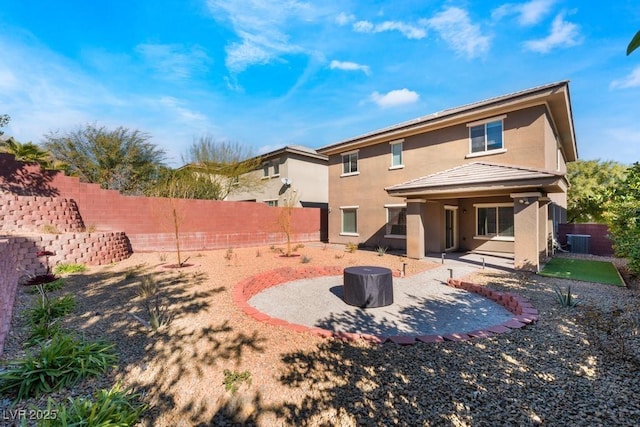 5735 Oak Bend Dr, Las Vegas, NV 89135 - rear view of house with stucco siding, a patio, and a fenced backyard