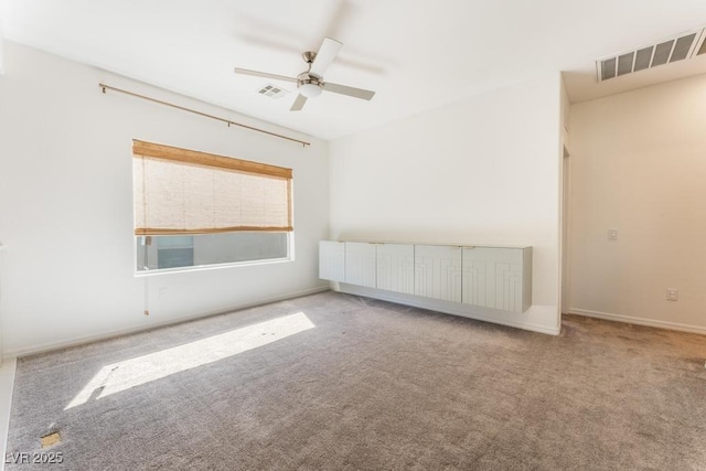 5735 Oak Bend Dr, Las Vegas, NV 89135 - carpeted empty room with radiator and a ceiling fan