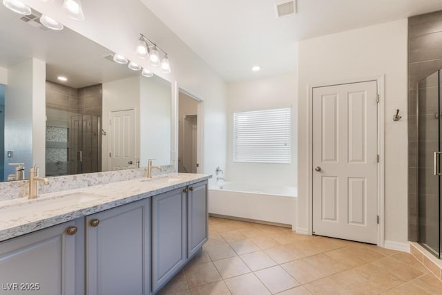 5735 Oak Bend Dr, Las Vegas, NV 89135 - bathroom with a shower stall, double vanity, a garden tub, and tile patterned floors