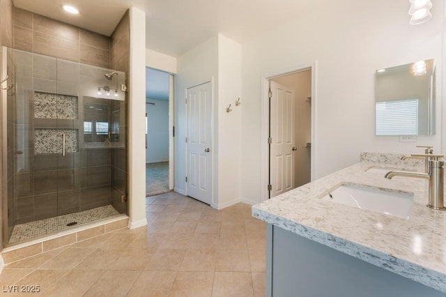 5735 Oak Bend Dr, Las Vegas, NV 89135 - full bath with double vanity, a stall shower, tile patterned flooring, and recessed lighting