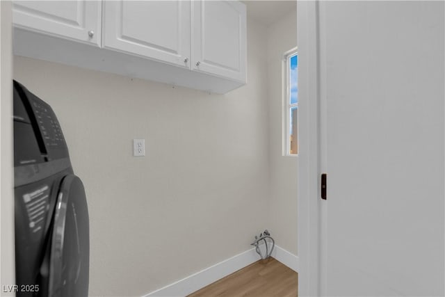 638 Ribbon Grass Ave, Las Vegas, NV 89183 - laundry room featuring cabinet space, light wood finished floors, and washer / clothes dryer