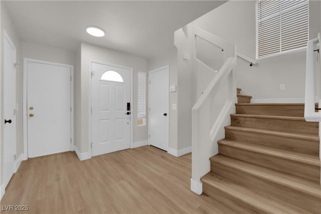 638 Ribbon Grass Ave, Las Vegas, NV 89183 - entryway featuring stairway and light wood-type flooring